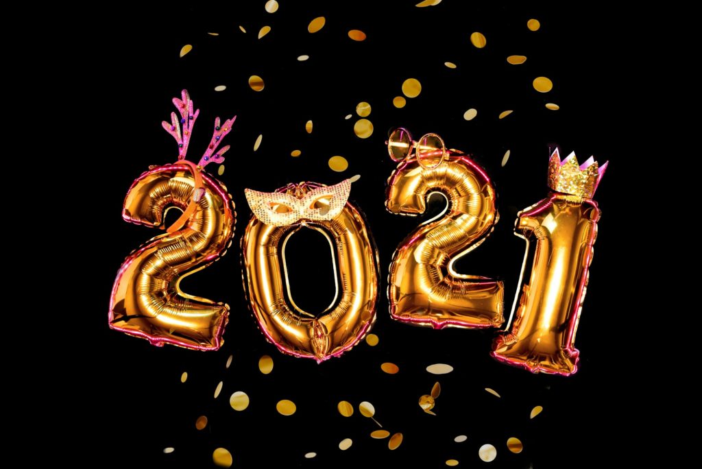 Gold numbers 2021 on black background in carnival accessories, new year party Gold numbers 2021 on black background in carnival accessories, new year party