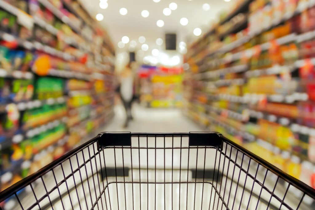 Abstract blurred photo of store with trolley in department store bokeh background