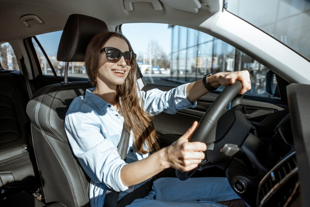 Woman driving car in the city