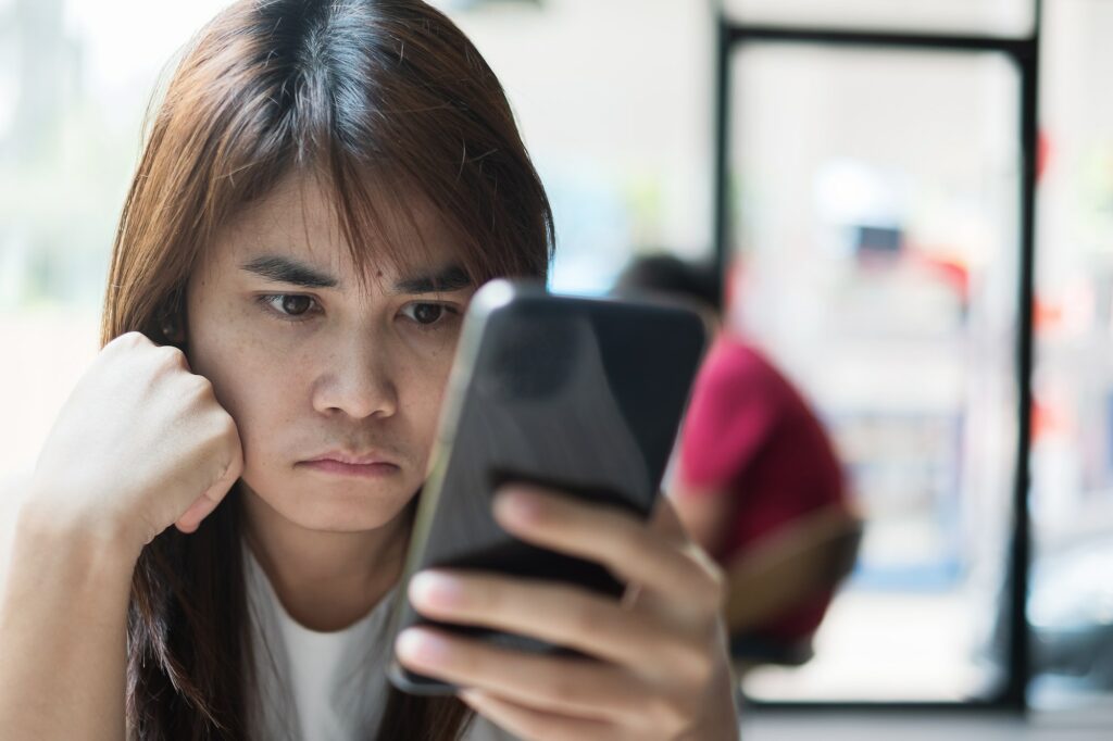 Woman boring during using smartphone