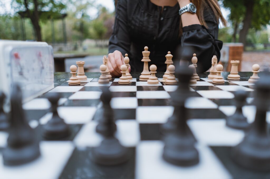 Young woman playing chess Young woman playing chess