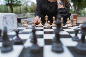 Young woman playing chess